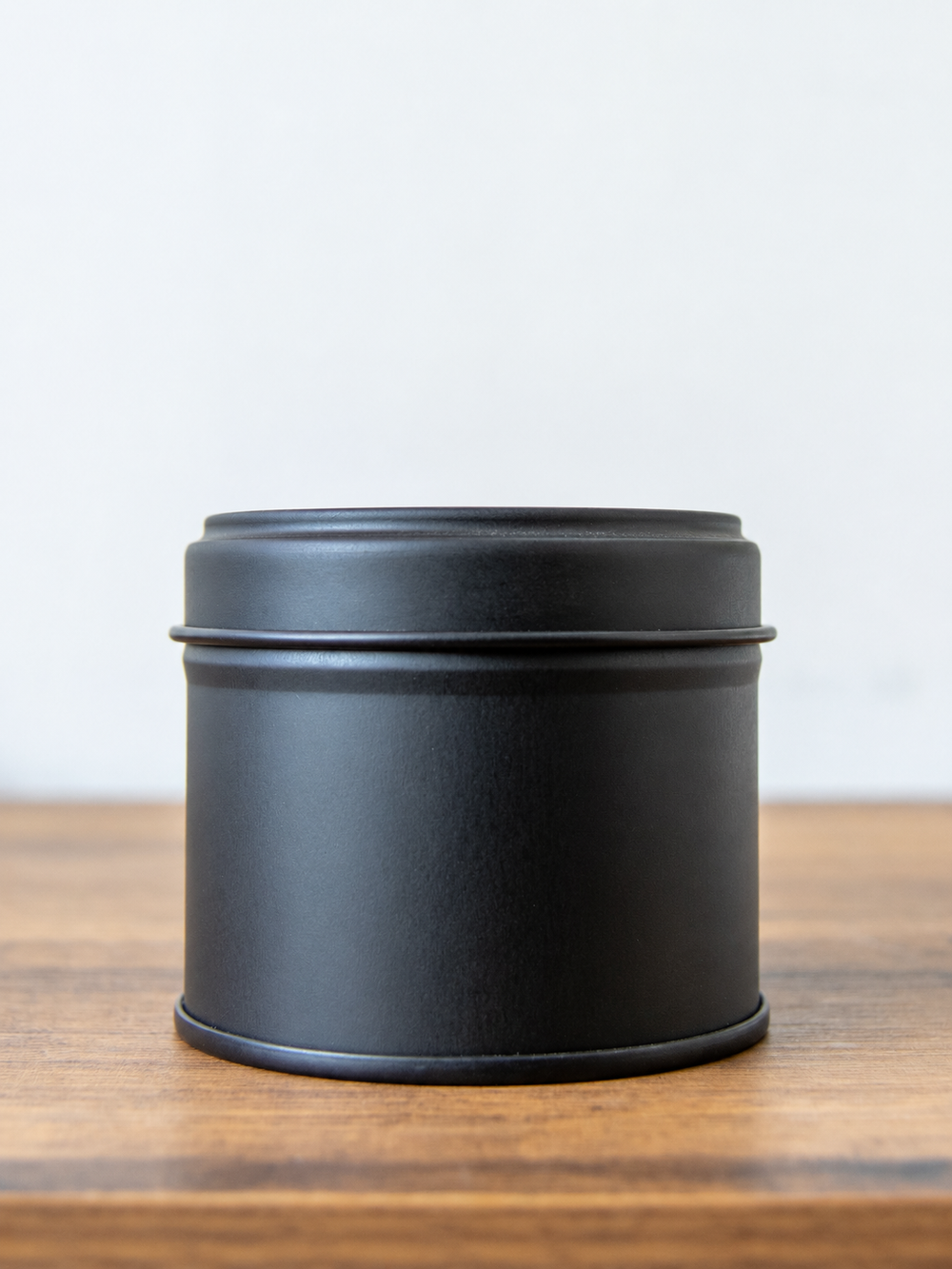 100g white label candle tin in matte black