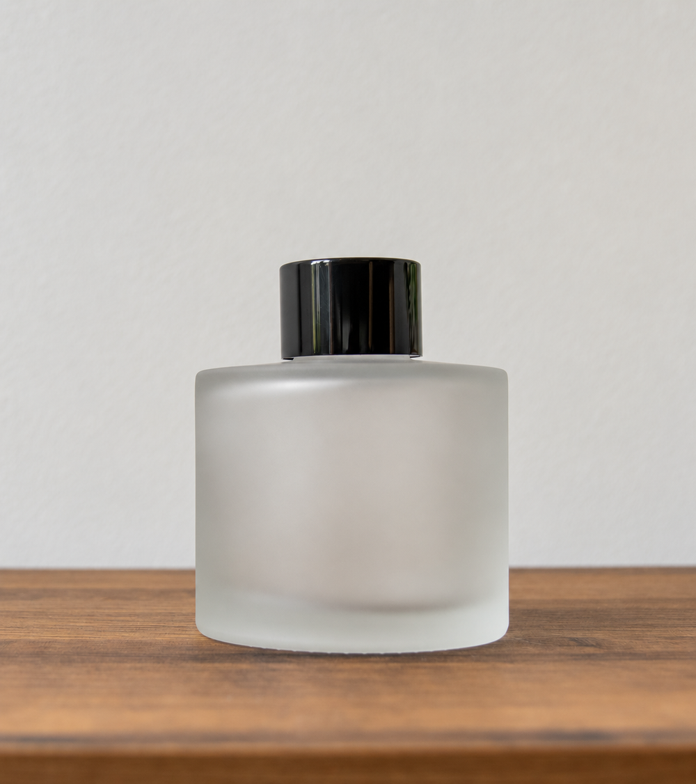 Reed diffuser bottle with black cap in Frosted Glass