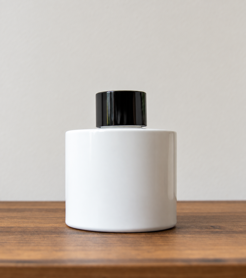 Reed diffuser bottle with black cap in White Gloss