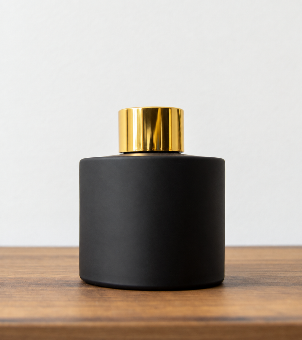 Reed diffuser bottle with gold cap in Black Matt